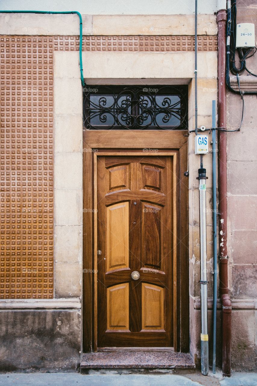 Charming door in the small town of Comillas located in Cantabria, Spain.  Comillas is a small town near Santander in the north of Spain, in between the mountains and the sea, its people enjoy a very good happy life.