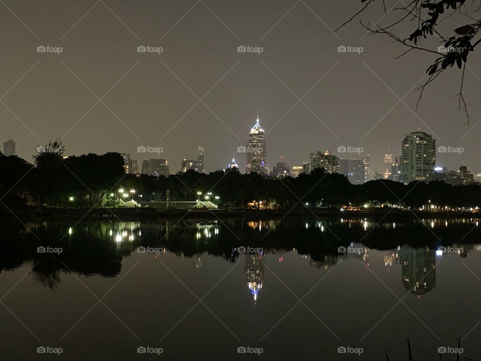 City around the tree and lake then combined in one, life in Bangkok city