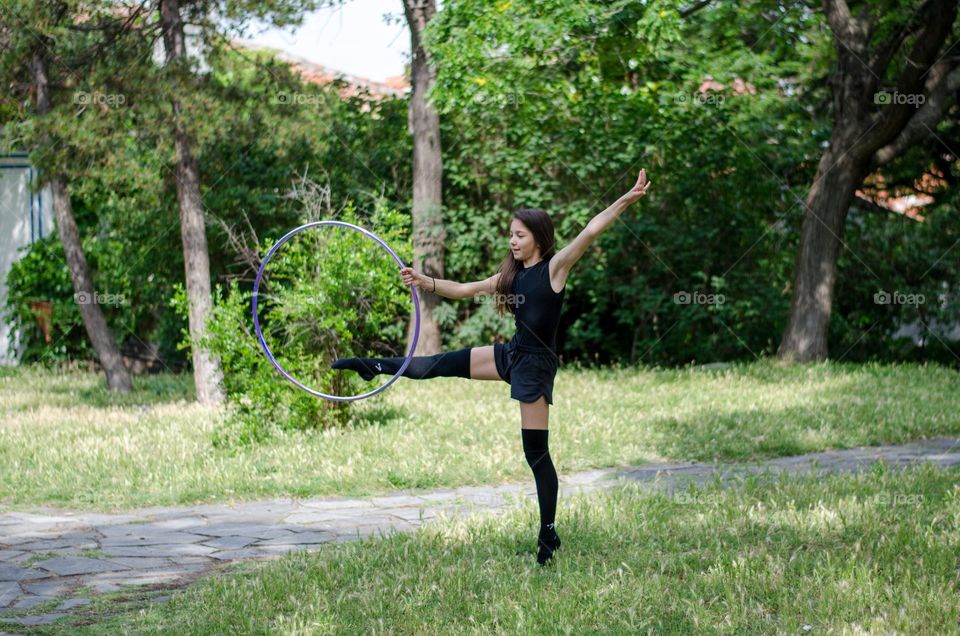 Beautiful Young Gimnast Dancing in Nature