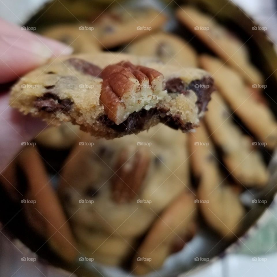 Partially Eaten Chicolate Chip Pecan Cookie close up