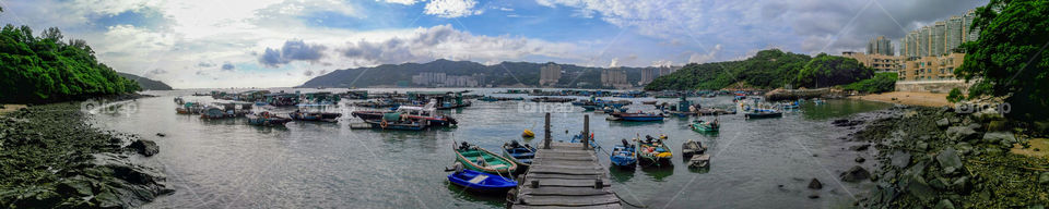 A panoramic view of the floating fishermen village on Ma Wan Island, Park Island property, and Kowloon