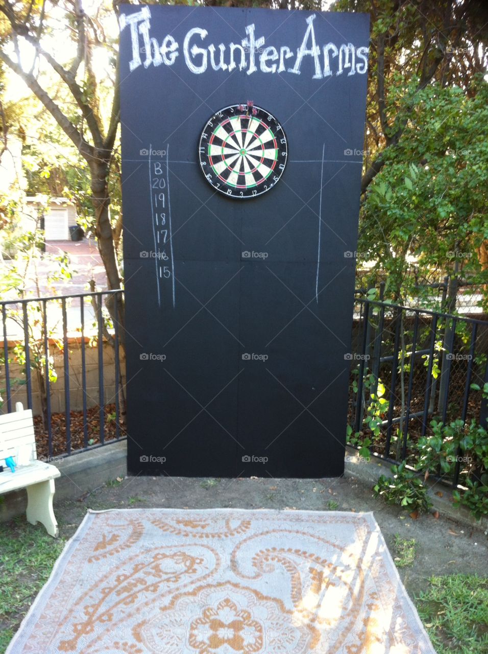 Darts board outside on black background 