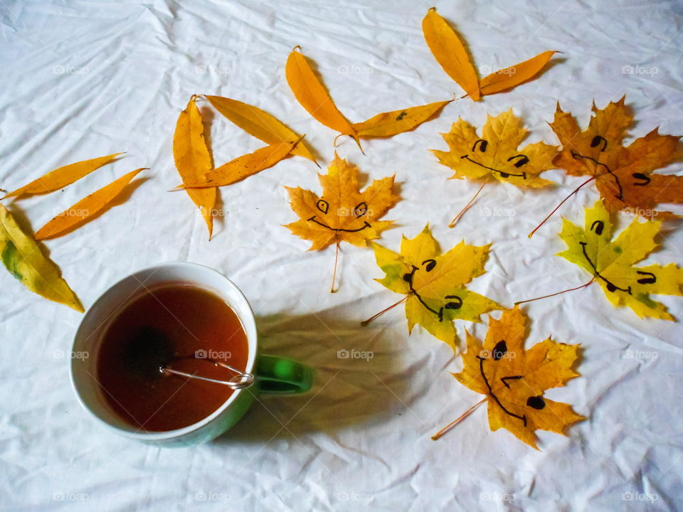 colorful autumn leaves and a cup of tea