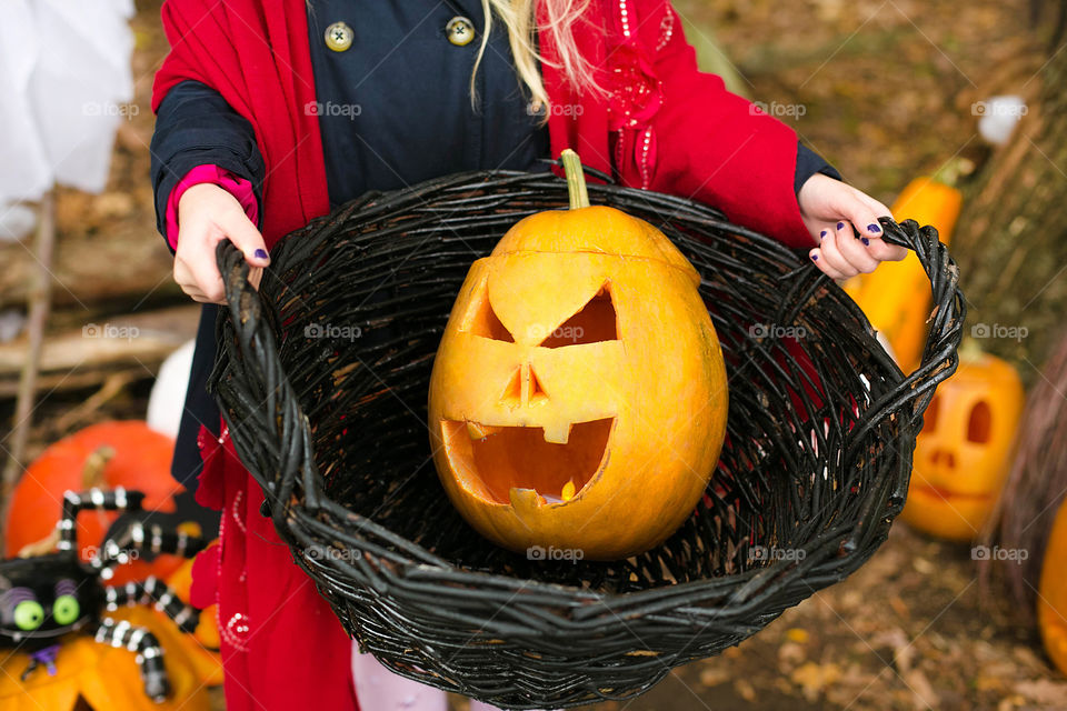 Women holding halloween in basket