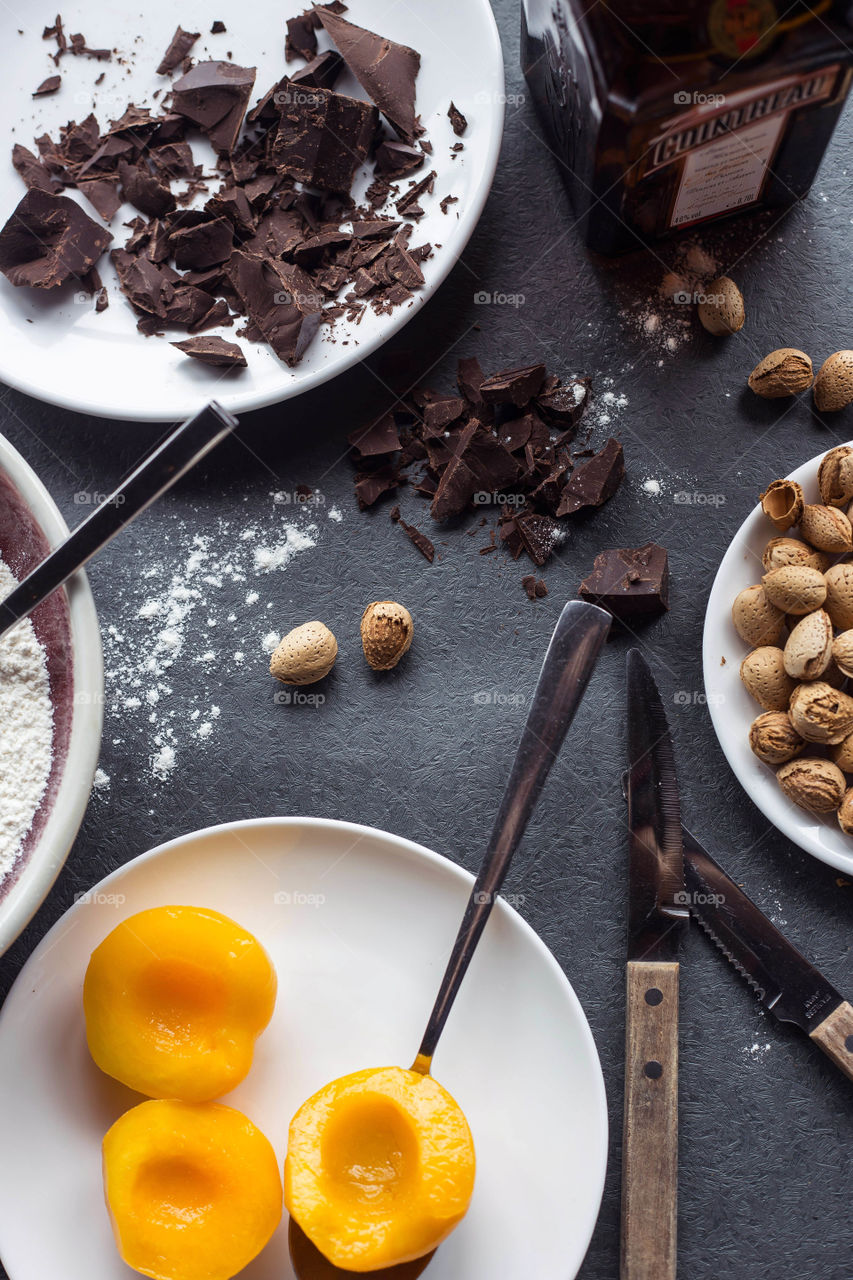 Peach halves, chocolate, flour... Hmmm... Wonder what we'll create from the oven. 