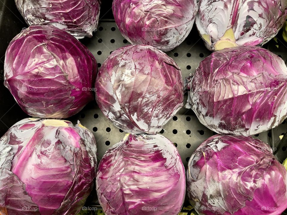 Red cabbage in the market shelf, top view 