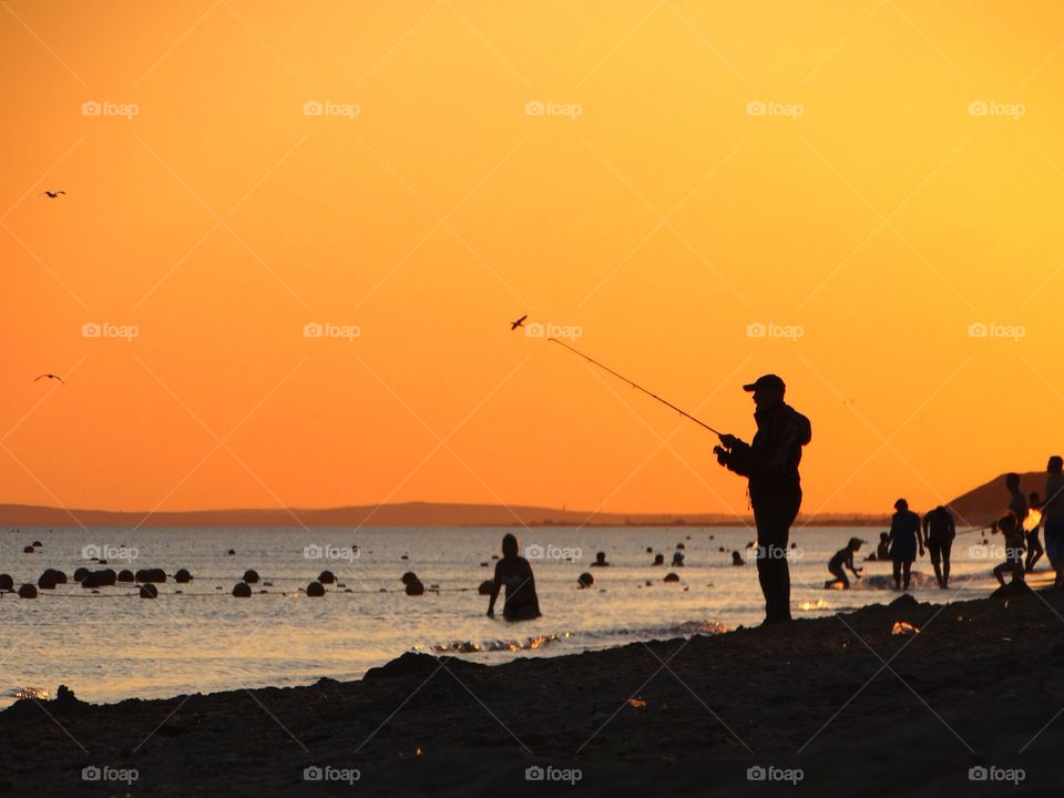 Fisherman and sunset