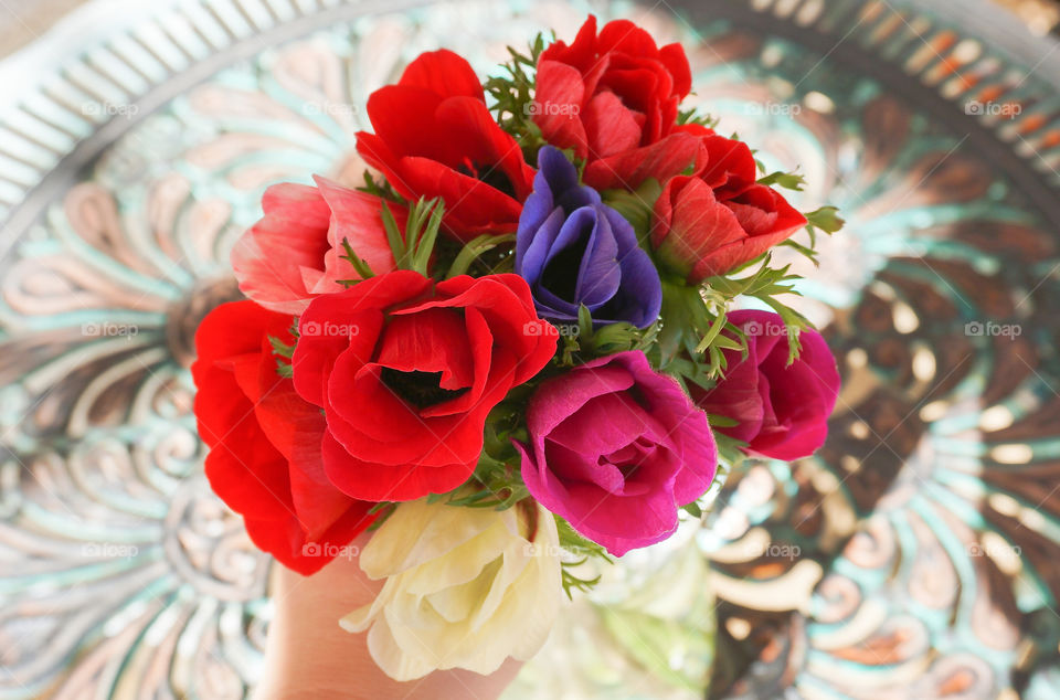 Flowers bouquet with hand