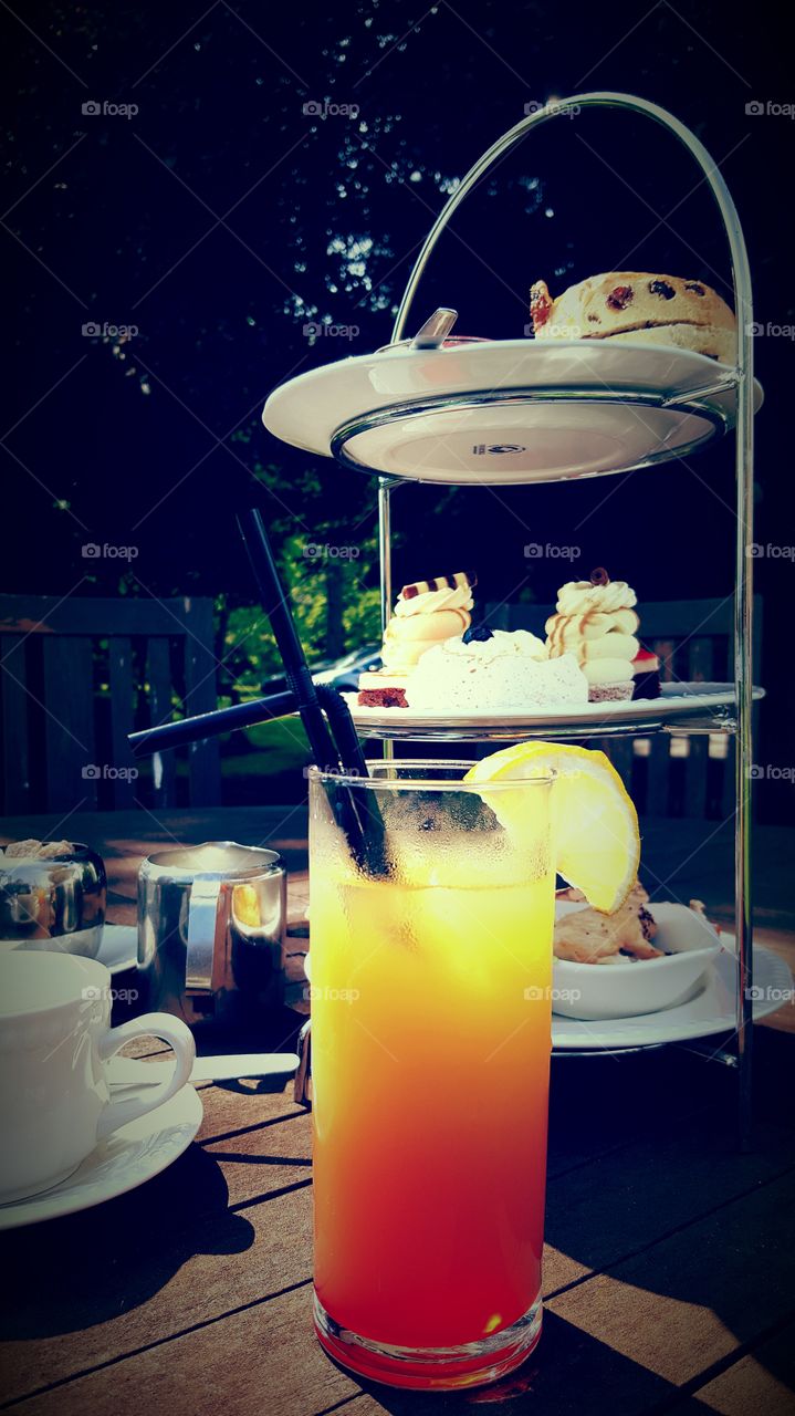 Summer cocktail while enjoying afternoon tea