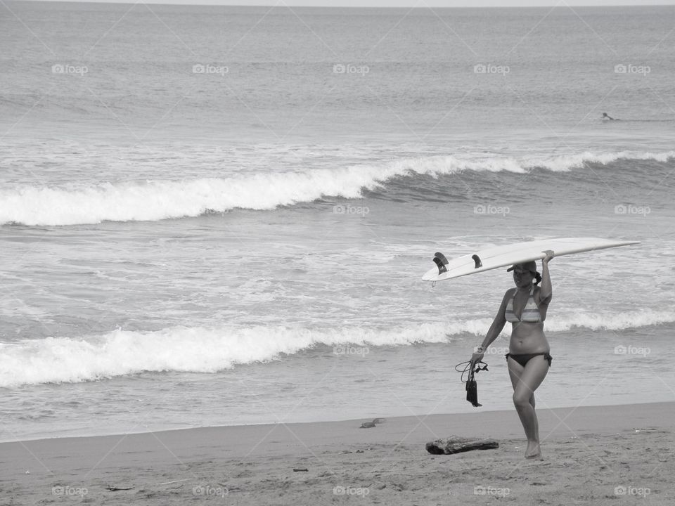 Longboard day. Walking on the beach with my longboard after surfed