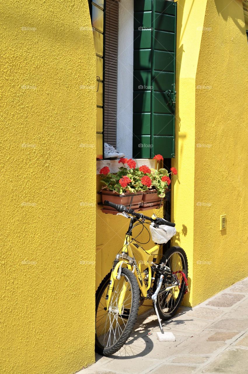 sport bike parked against a yellow wall 