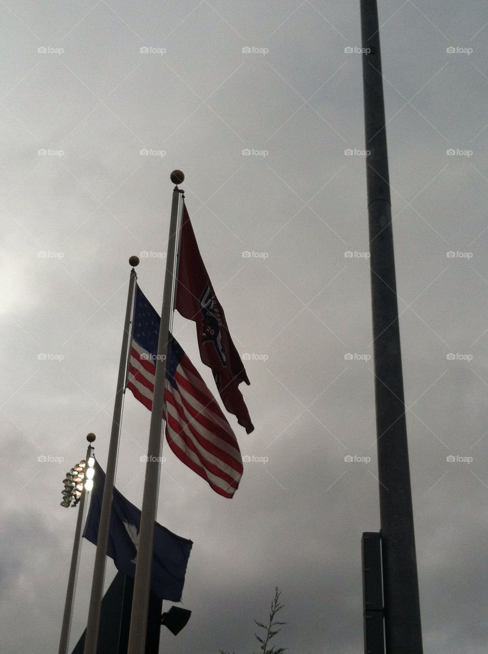clouds storm flag flagpole by tdkelly