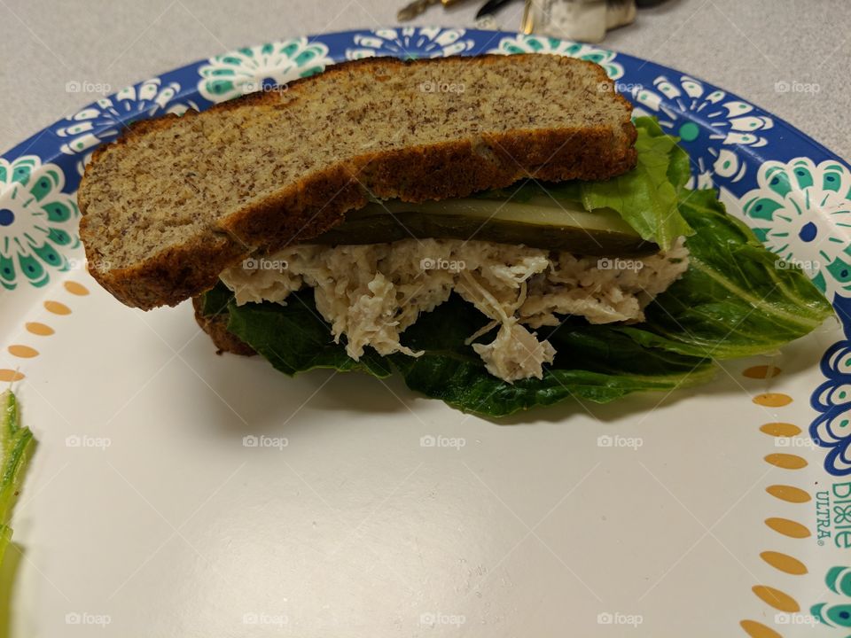 chicken salad sandwich with lettuce and pickle