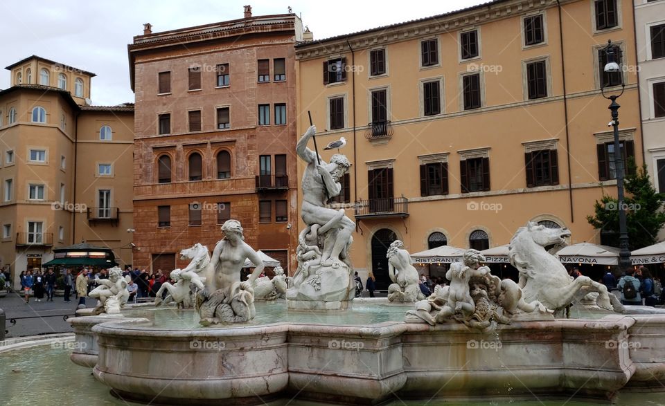Statue details view of the famous Fountain of Neptune in Piazza Navona, Rome, Italy, Europe.