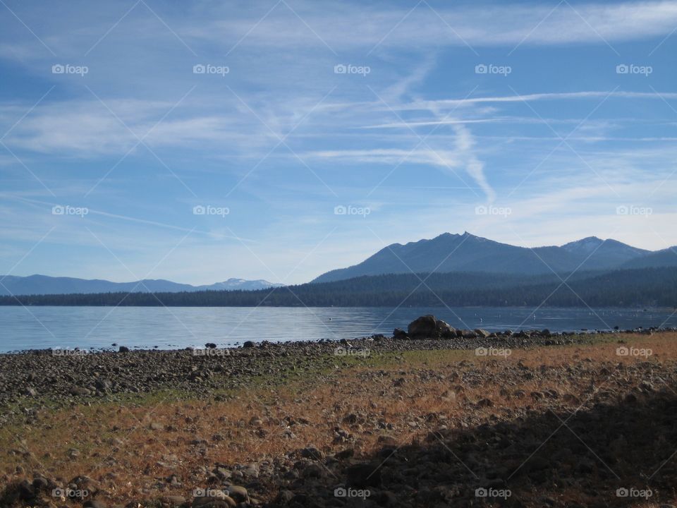 Lake surrounded by hills. Blue lake surrounded by hills