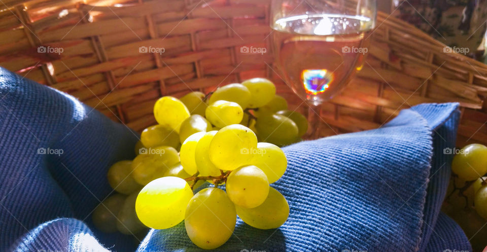 Sunlit grapes and wine