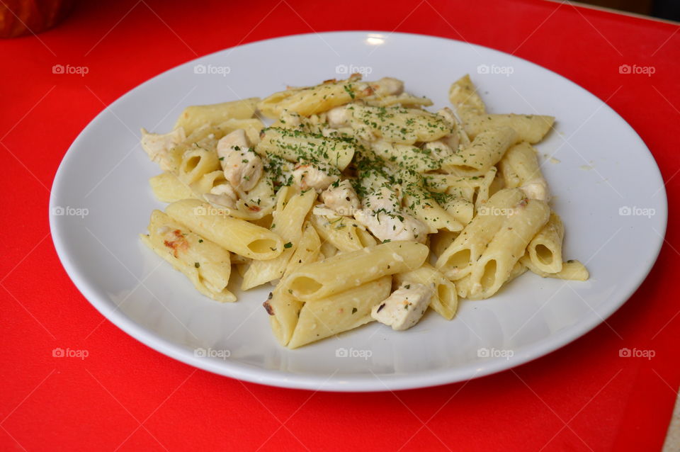 Close-up of pasta against red background