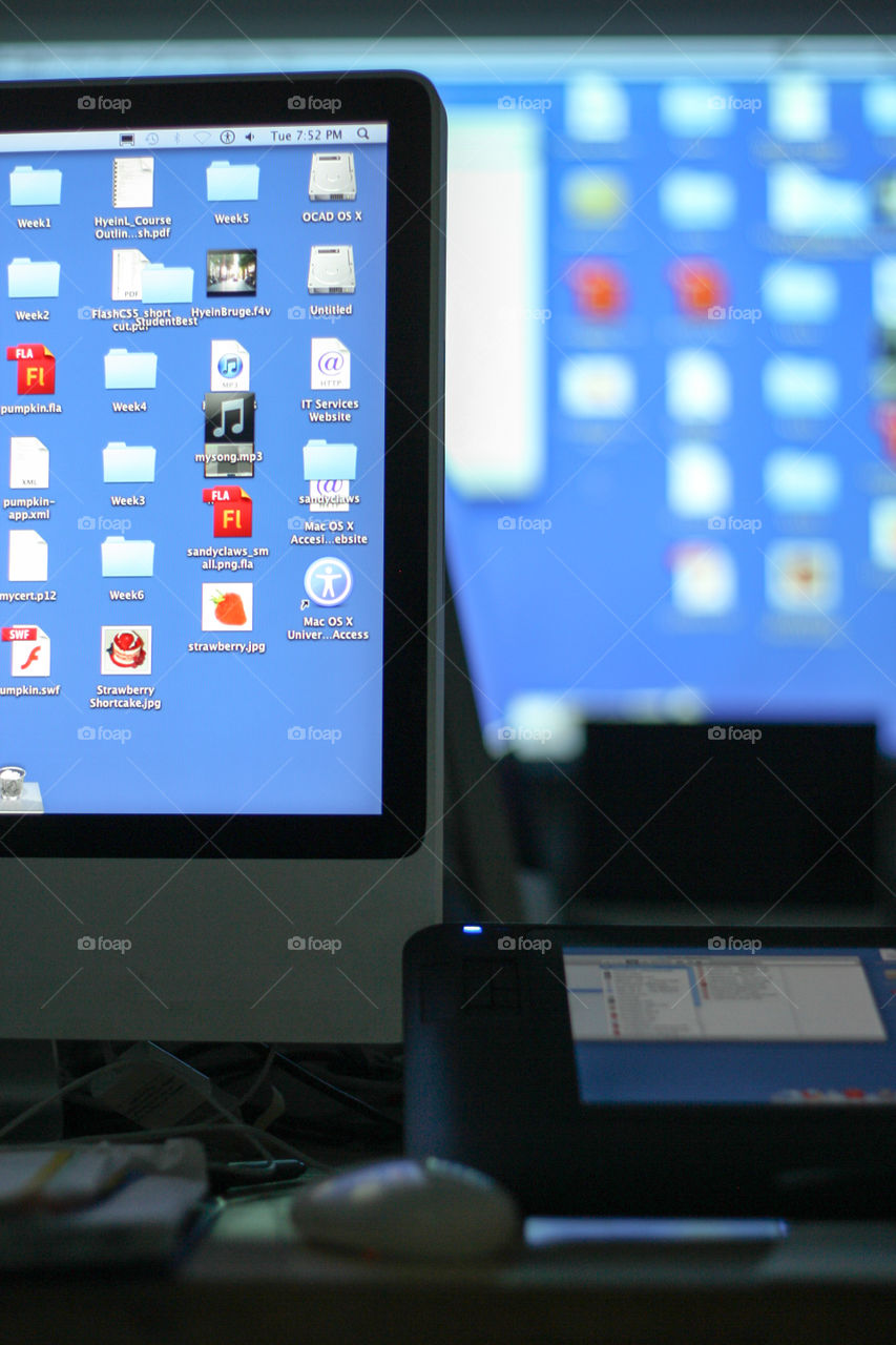 Glowing computer screens in a computer lab