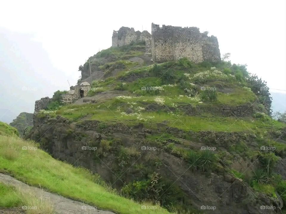 A stunning view of green mountains covered in fog in Yemen