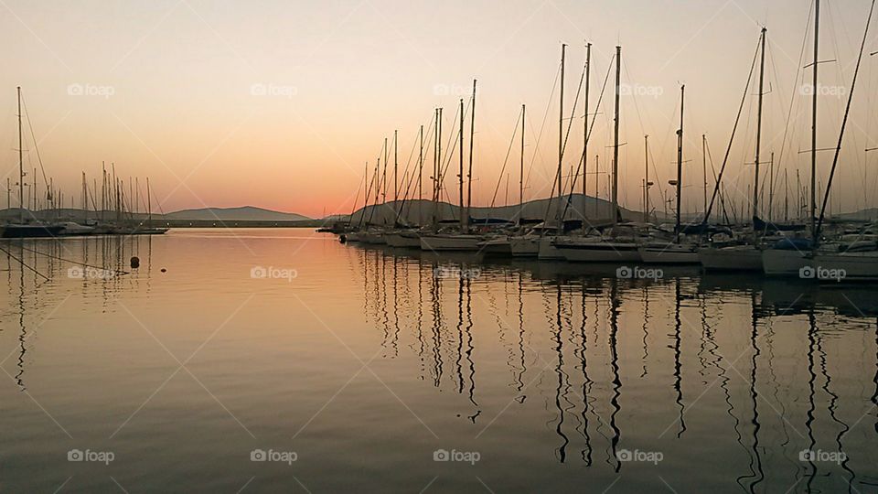 sunset reflection over boat