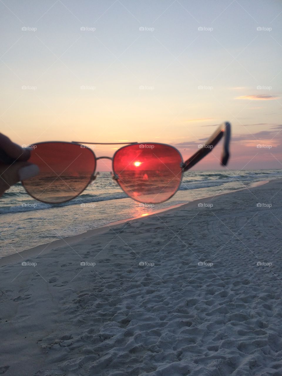 The sun looking through sunglasses 