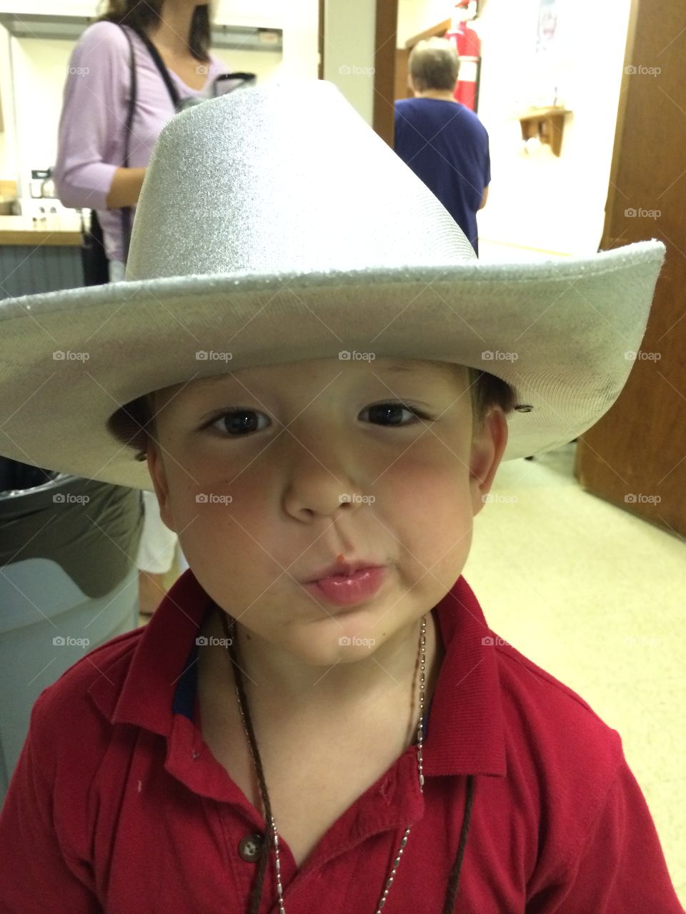 Boy in Hat. Grandson enjoying his cowboy hat. 