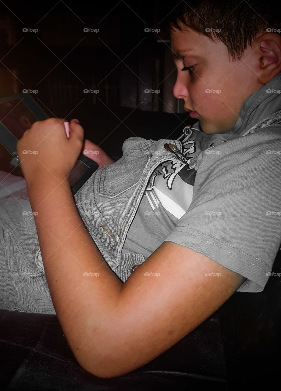 My boy playing with his DS computer