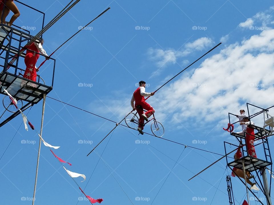 High wire bicycle act