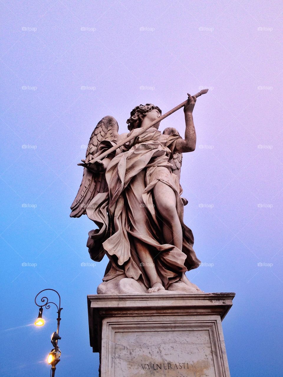Angel With the Lance. Sculpted by Domenico Guidi, this angel can be seen at Ponte Sant'Angelo, in the heart of Rome, Italy. 