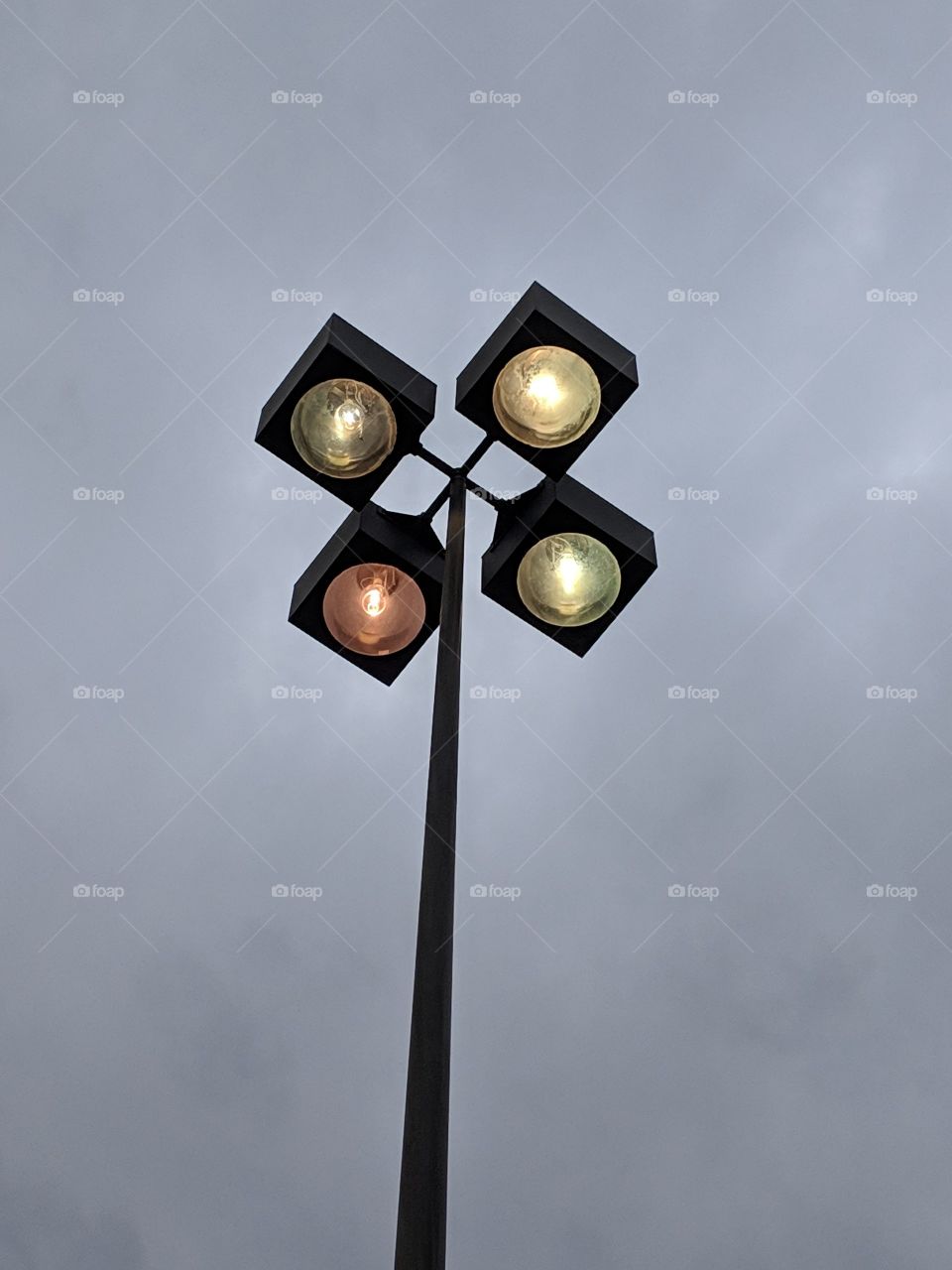 Four lights against a gloomy sky