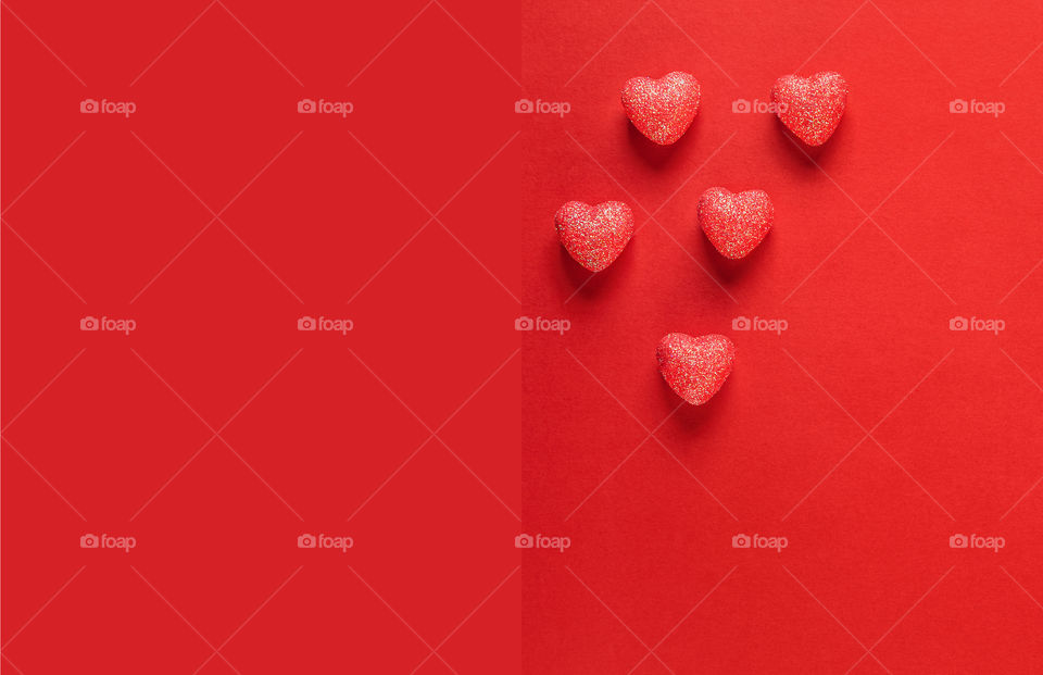 Postcard. Red hearts on a red background. Valentine's Day.