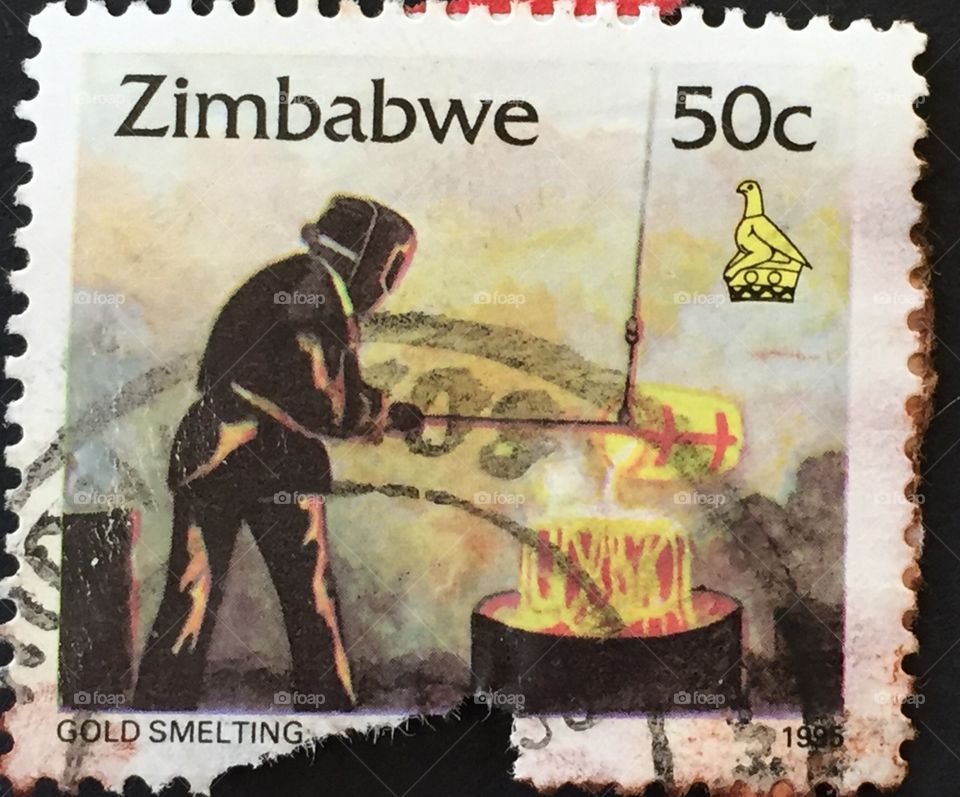 Zimbabwe stamp showing gold smelting 