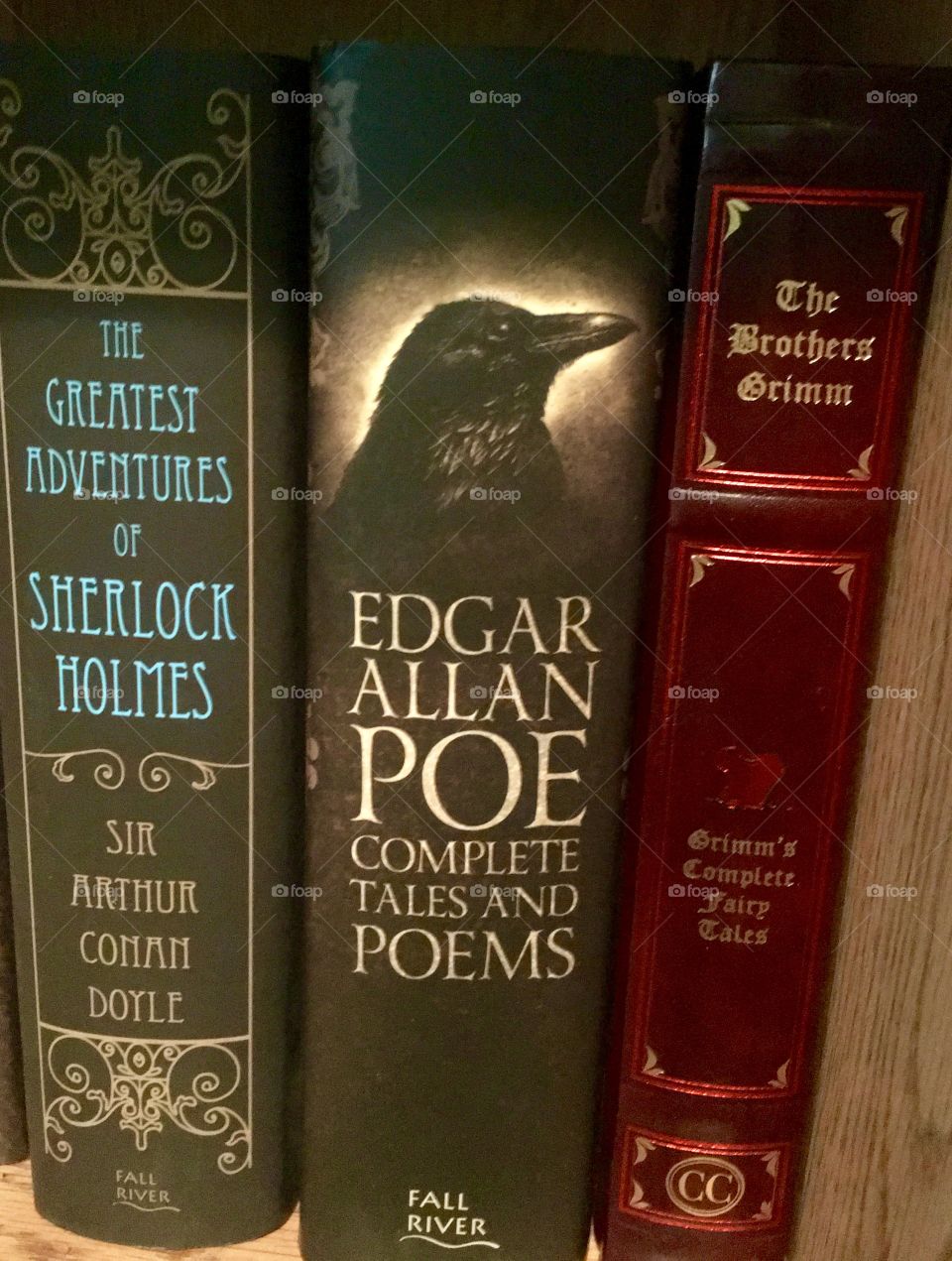 
The Greatest Adventures of Sherlock Holmes,
Edgar Allan Poe Complete Tales and Poems, and
Grimm's Complete Fairy Tales.
Three books that I got all at the same time but which book should I read first?