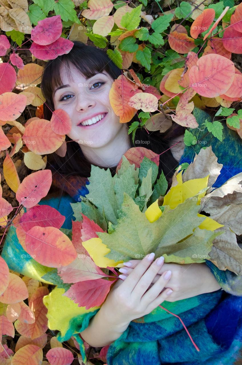 Energetic, Light-Hearted, and Vibrant Portrait of Girl on Autumn Background