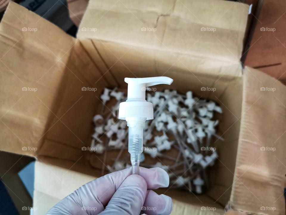 Dispenser pumps inside a box