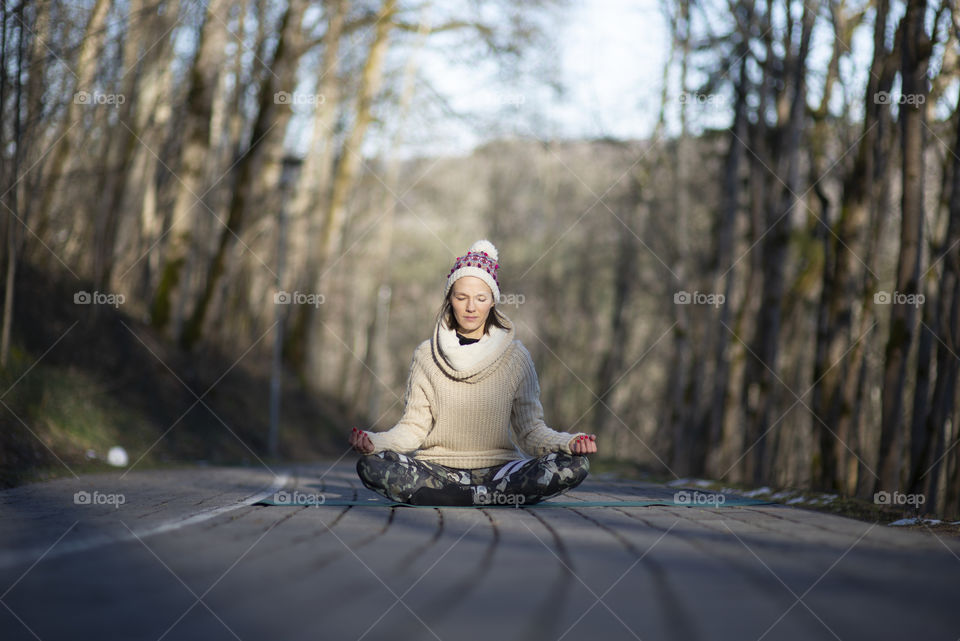 Woman doing hahta yoga outdoor