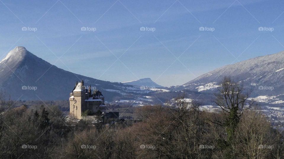 View of "Chateau de Monthon" and snowy mountains.