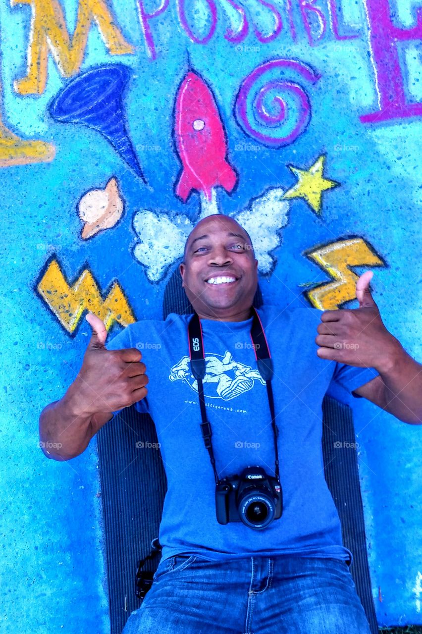 Happy man gesturing thumbs up