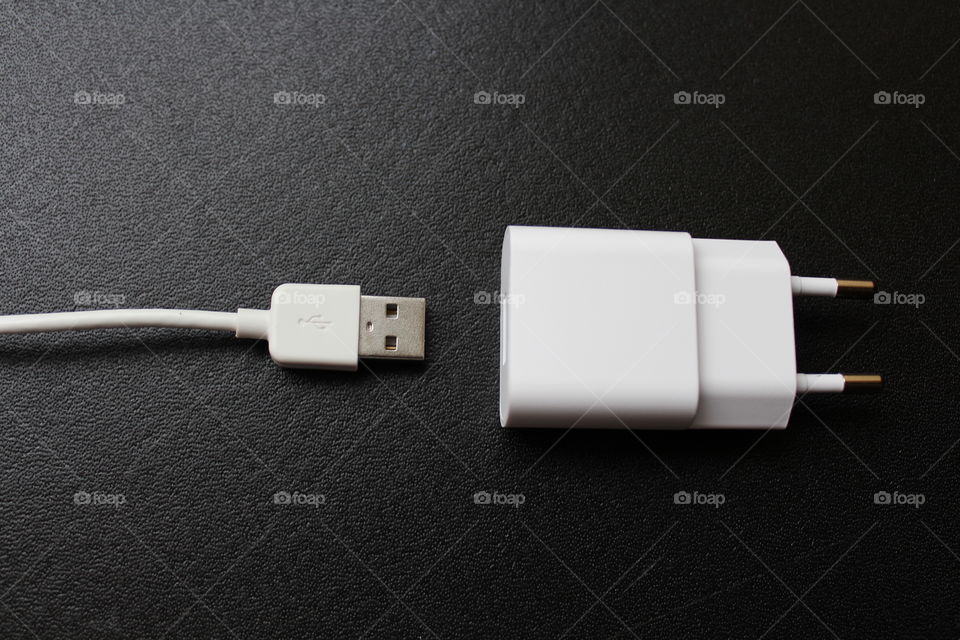 White charger and USB cable