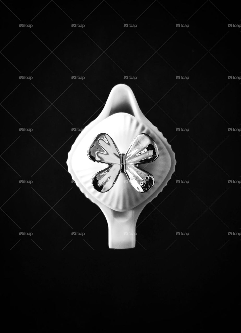 top view of coffee pot on black background , black and white , minimal concept