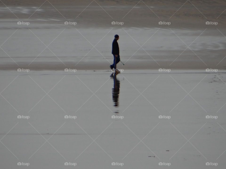 beach water man walking by kshapley