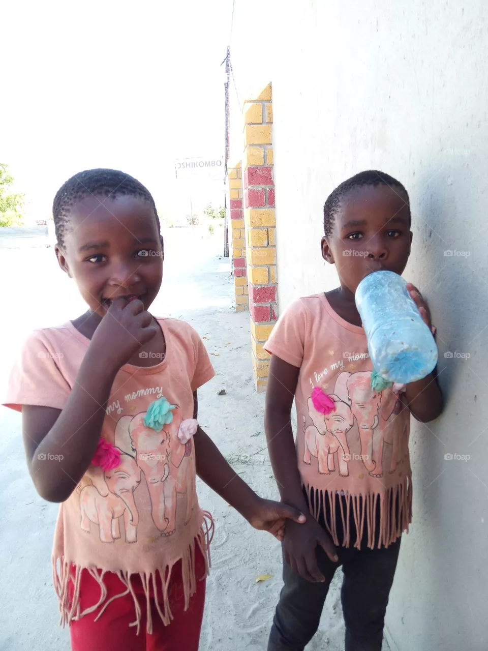 This photo consists of two beautiful twin girls who were very happy to see me after a very long time.