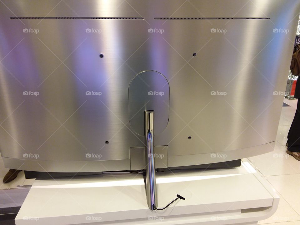 Samsung QLED curved screen television showing metallic silver back