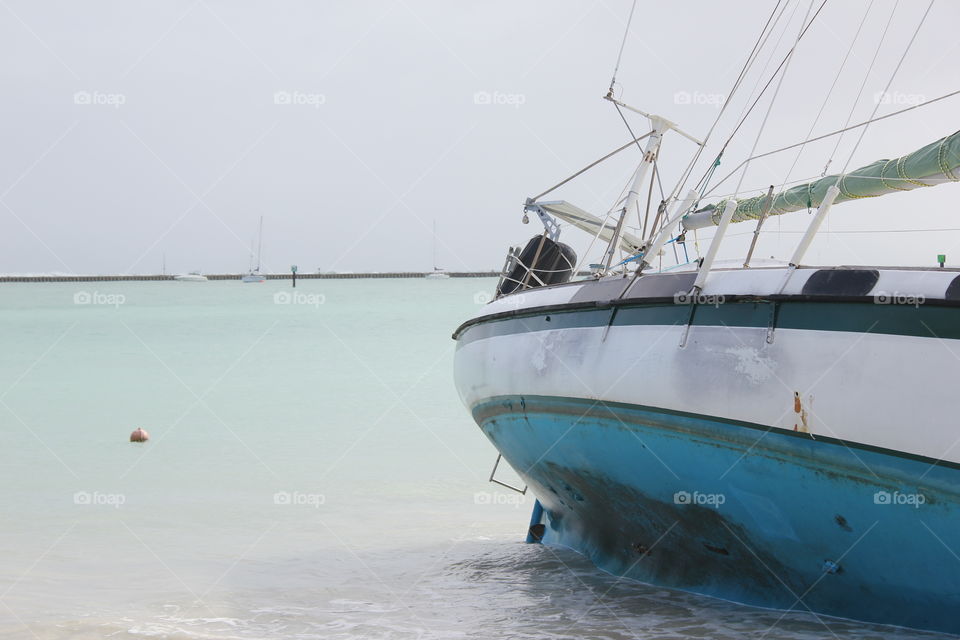 Sailboat pushed into shore by a hurricane