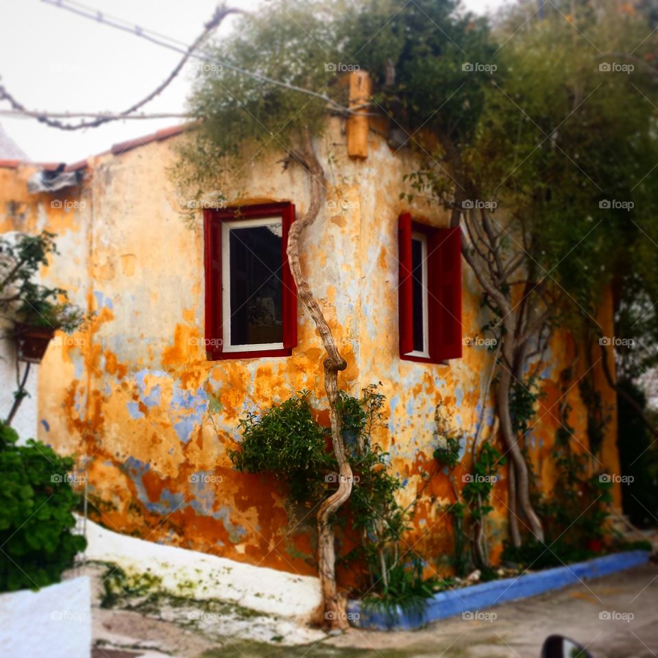 Old colored house. Walk in Anafiotika