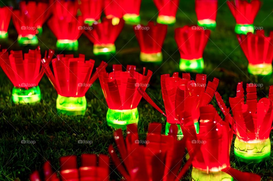 Red and green lights made by school children out of old plastic bottles
