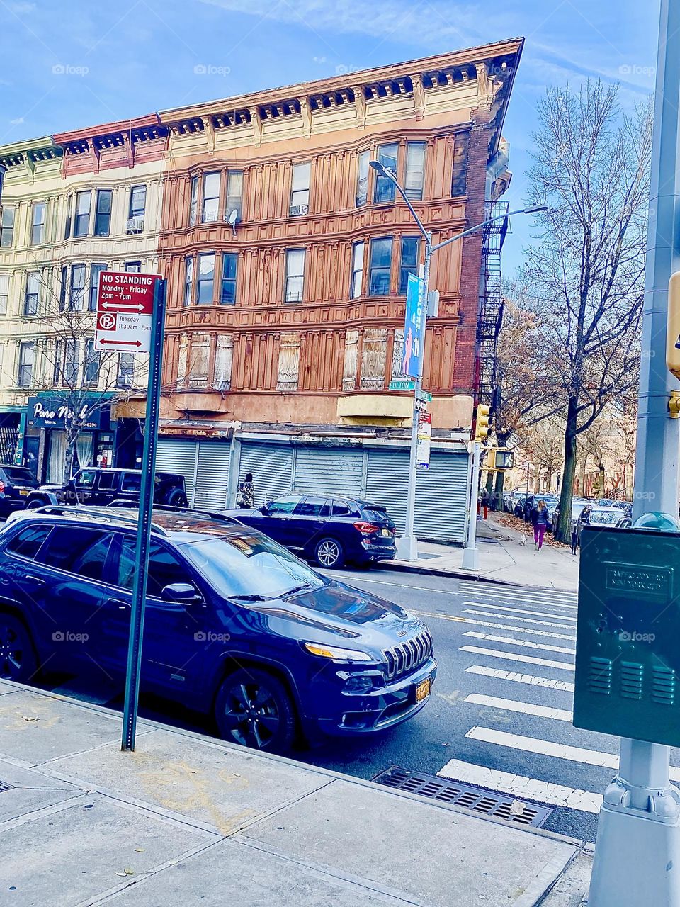 A brownstone on Fulton Street in Fort Greene, Brooklyn, New York photographed on an unseasonably warm sunny December afternoon in 2021. Hypnotic Productions
