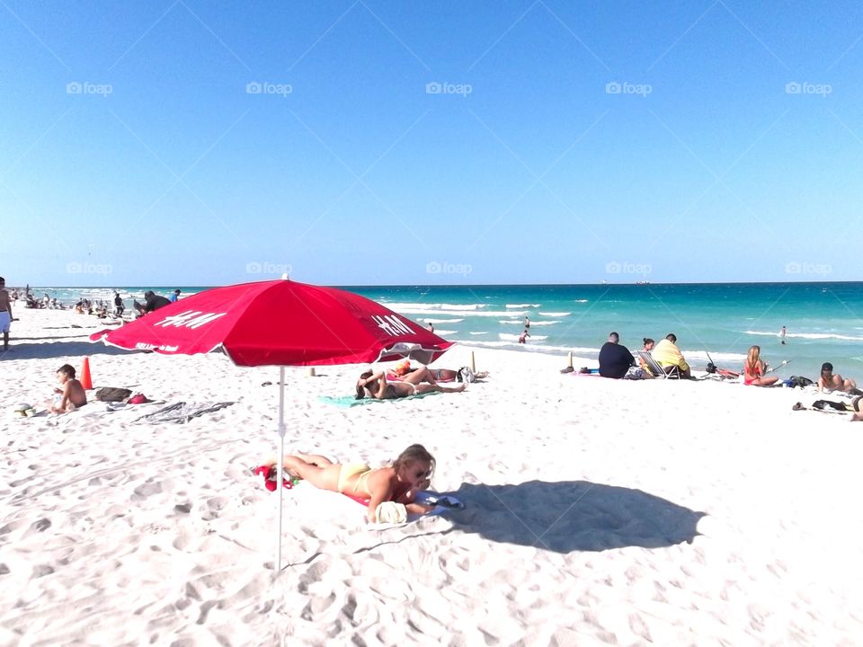 Relaxing on white sandy beach