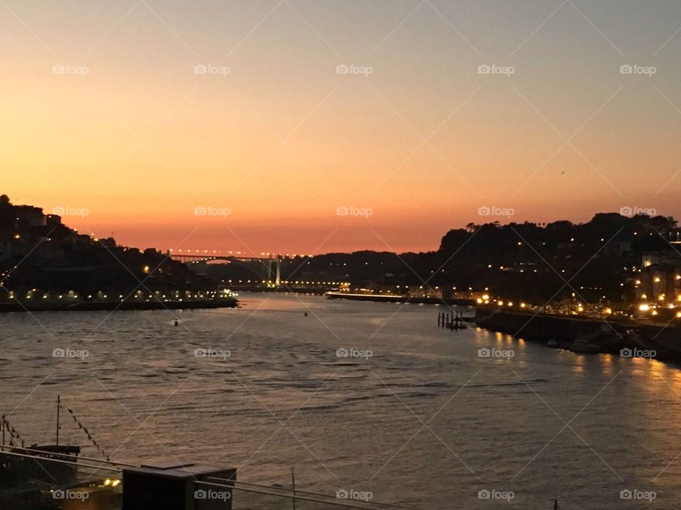 Sunset over the bridge in Porto (Portugal)