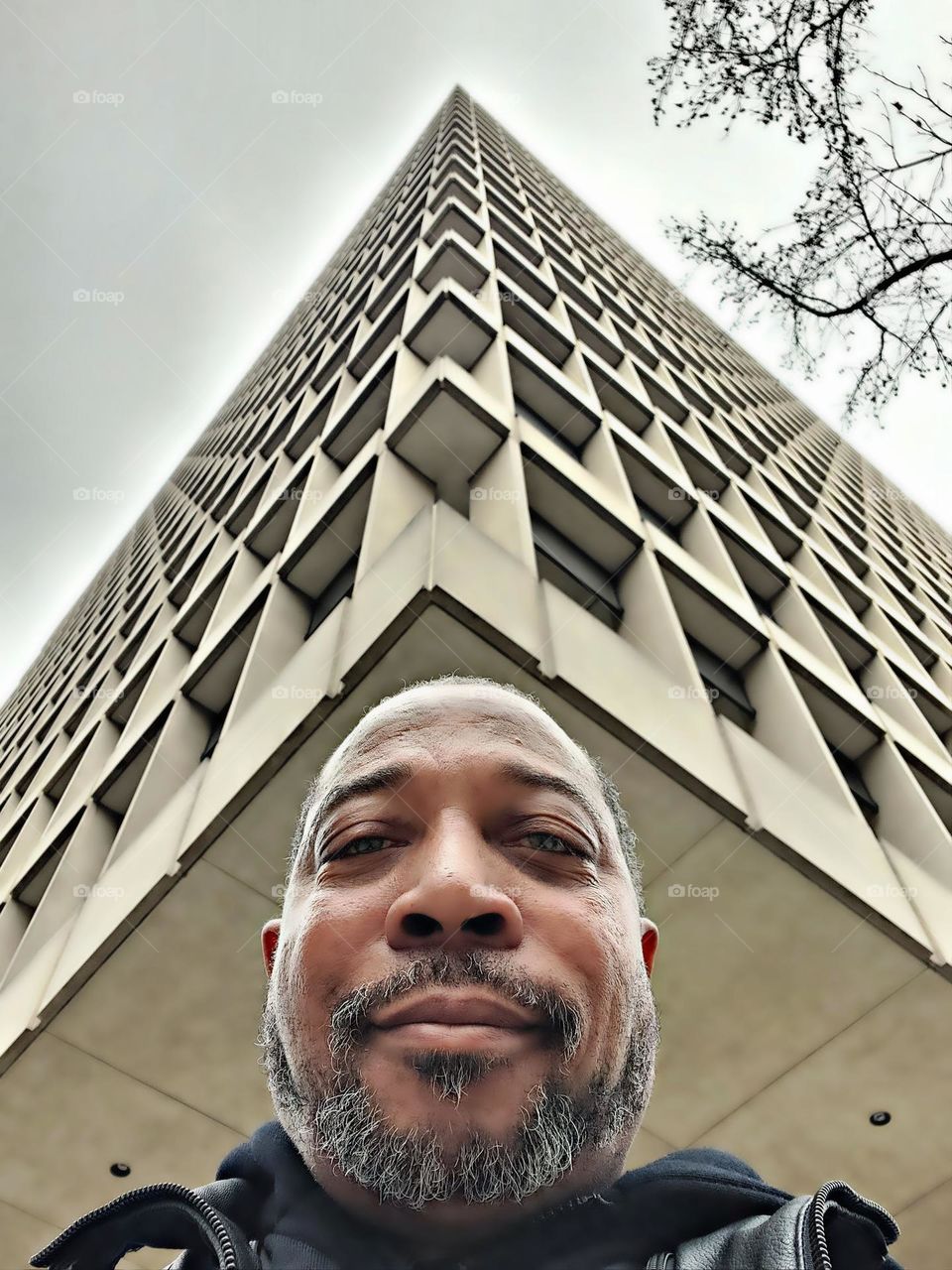 selfie pic taken under a architectural building